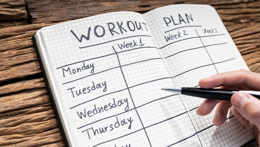 a workout journal open on a table