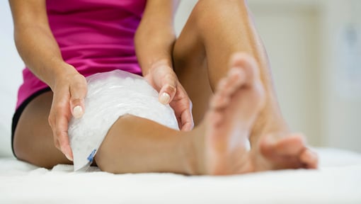 woman using ice for cold therapy