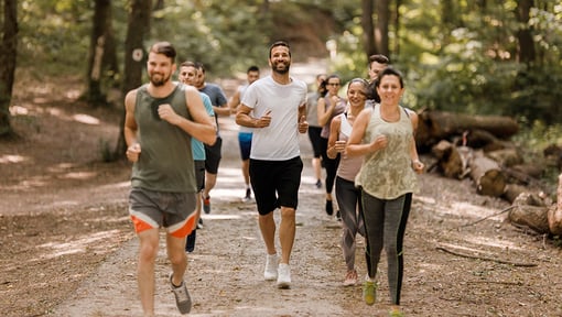 people running in a run club out in the wilderness