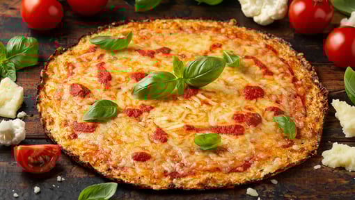 a cheese pizza made out of cauliflower crust