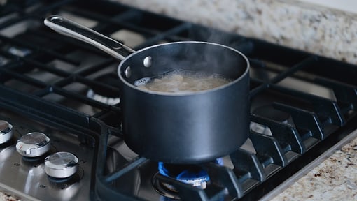 A pot boiling on a burner for a one-pot recipe