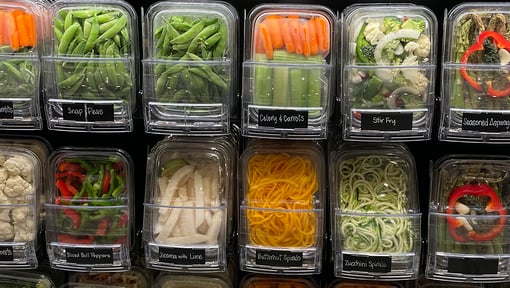 Pre-washed diced vegetables in the produce isle at a grocery store