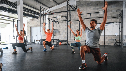 Several people doing Hip Flexor at a Gym