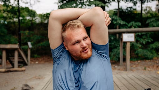 Man stretching after intense workout