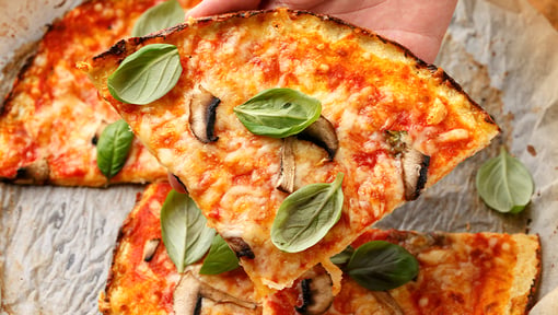 Homemade pizza topped with vegetables for a balanced family meal.
